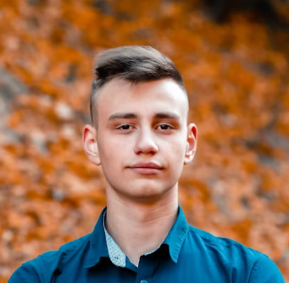Young man autumn background portrait